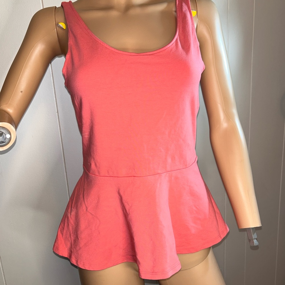 Pink Peplum top with a crossed back in Medium